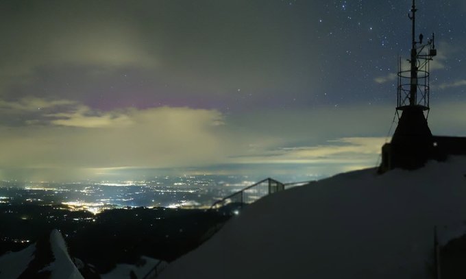 Northern lights illuminate the Swiss night sky