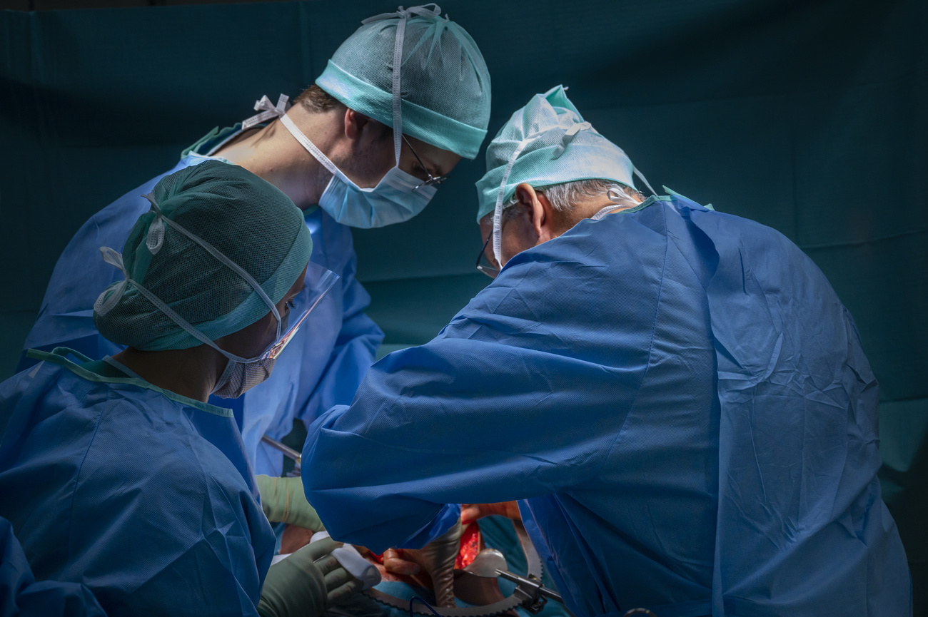 Surgeons performing an organ transplant