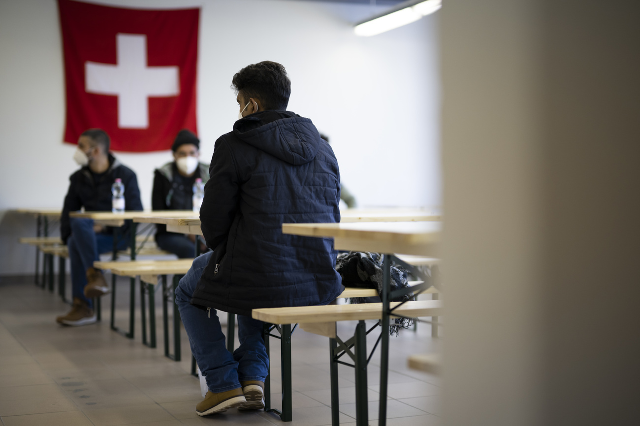 Asylum seekers wait at a centre in Buchs, eastern Switzerland, January 2022.