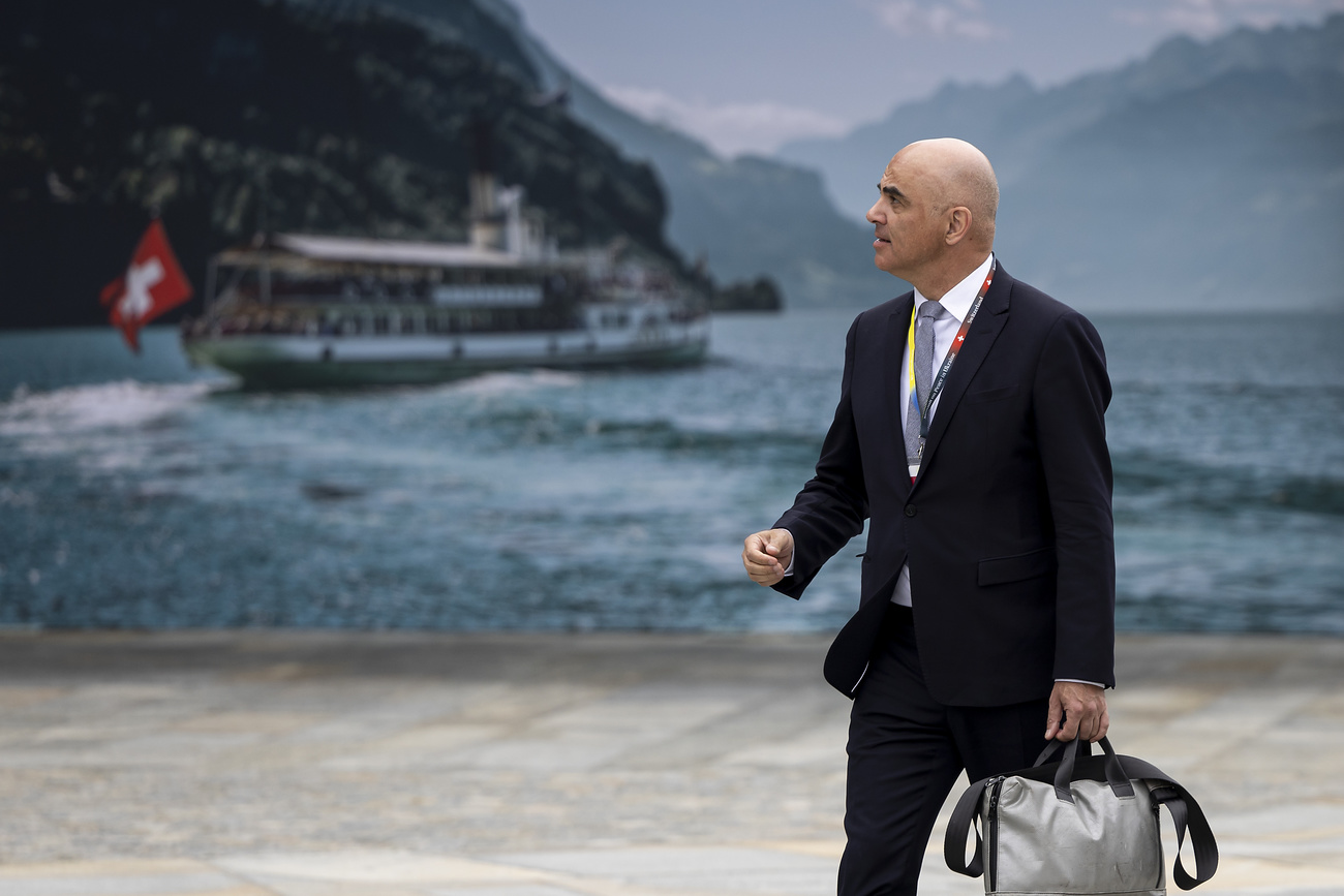 alain berset beside a lake