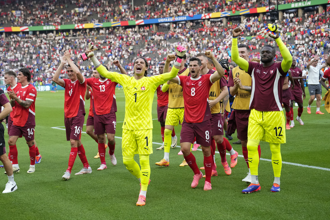 Switzerland players celebrate after a round of sixteen match between Switzerland and Italy at the Euro 2024 soccer tournament in Berlin, Germany, Saturday, June 29, 2024.