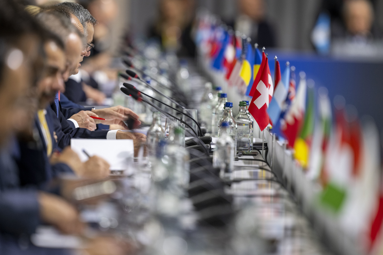 National flags represent delegates at the Ukraine peace conference.