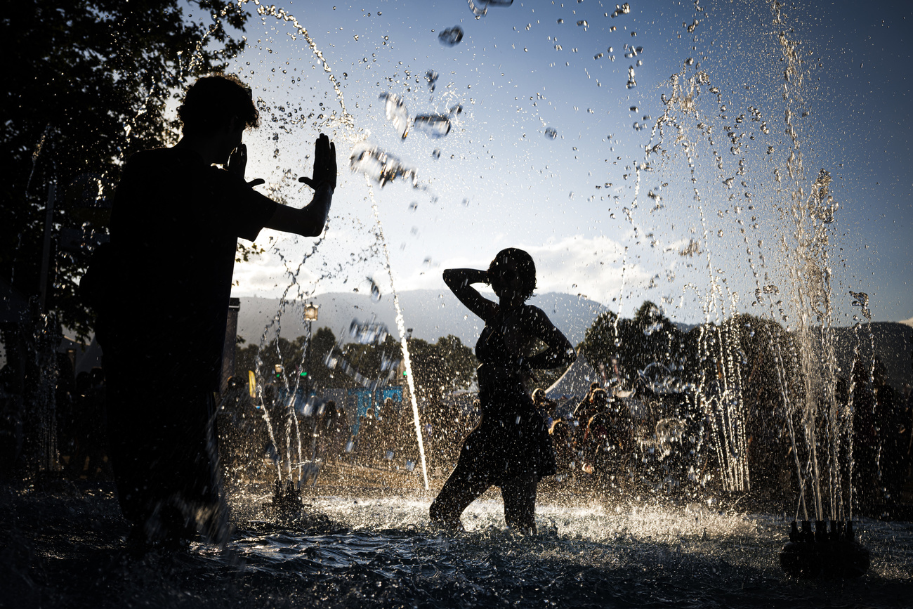 People bathing in a fountain