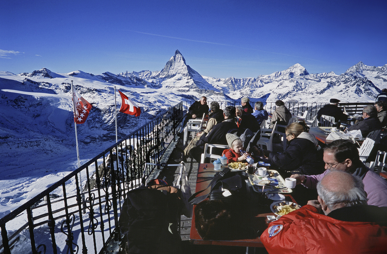 Tourists take in a view of the Matterhorn in Switzerland