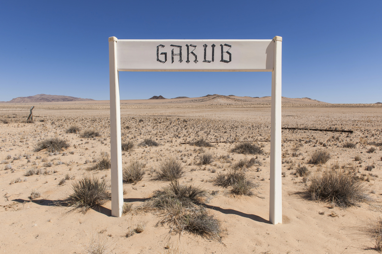 A sign for Garub railway station from the German colonial period, in the middle of the Namib Desert, Namibia.