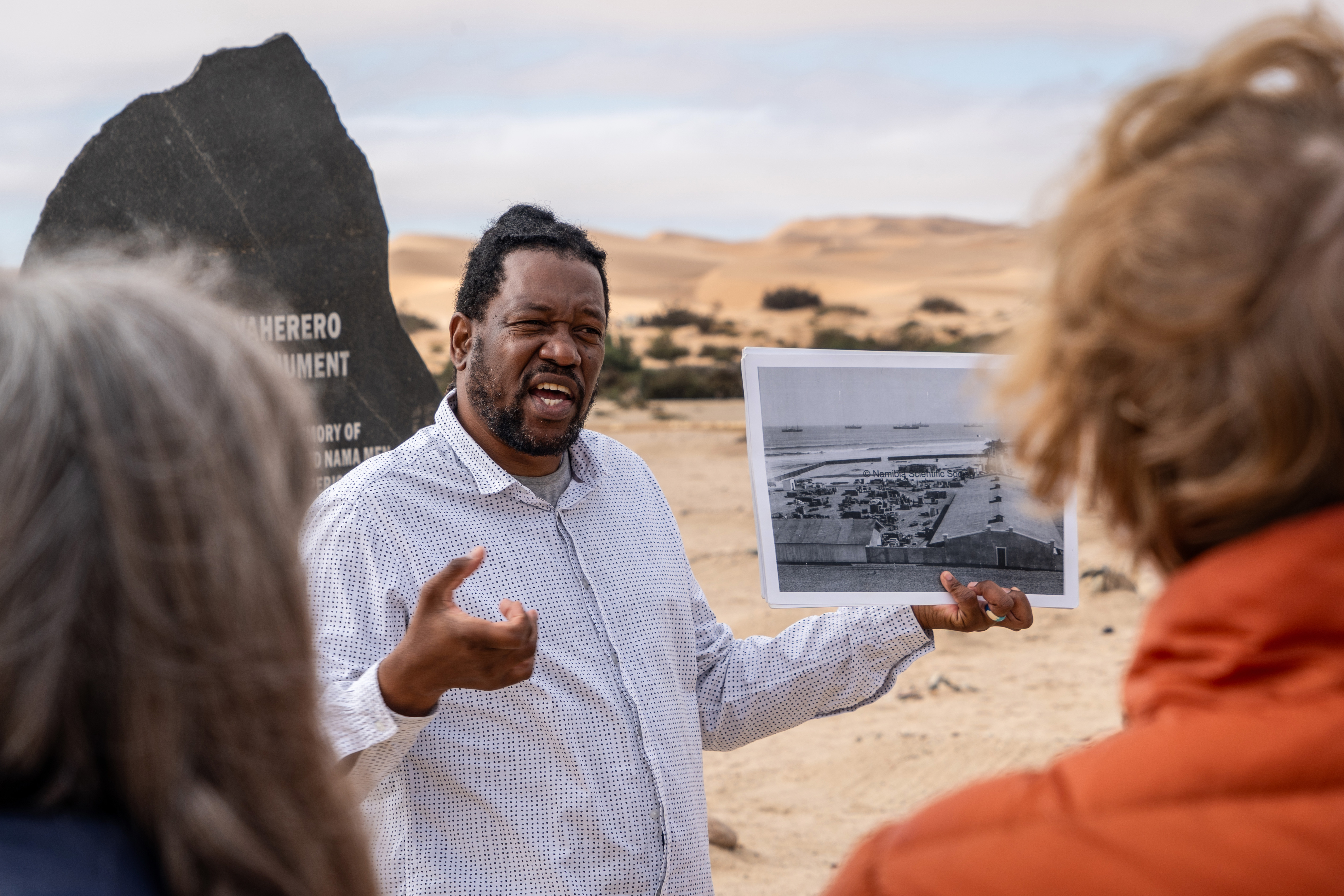 Laidlaw Peringanda talks to tourists about colonial history and genocide in German West South Africa.