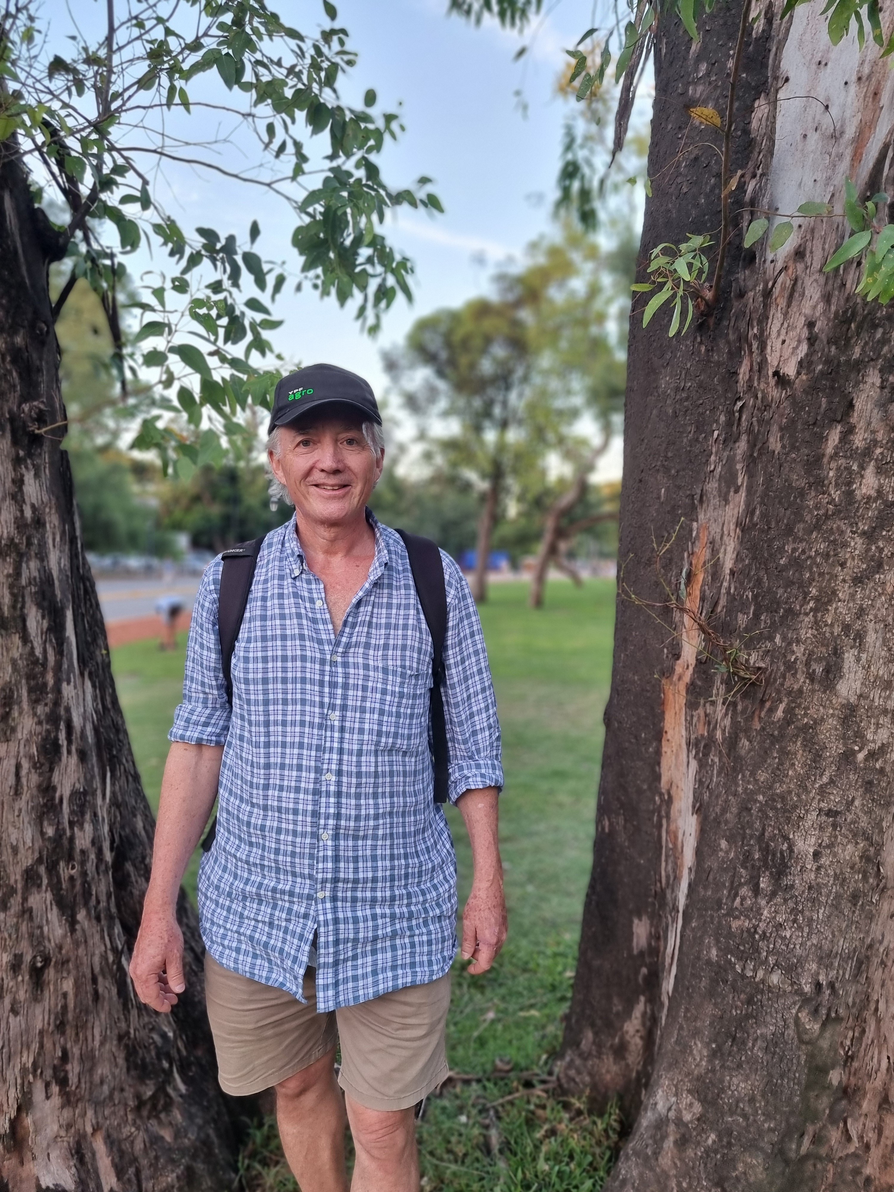 Man wearing a blue shirt and hat