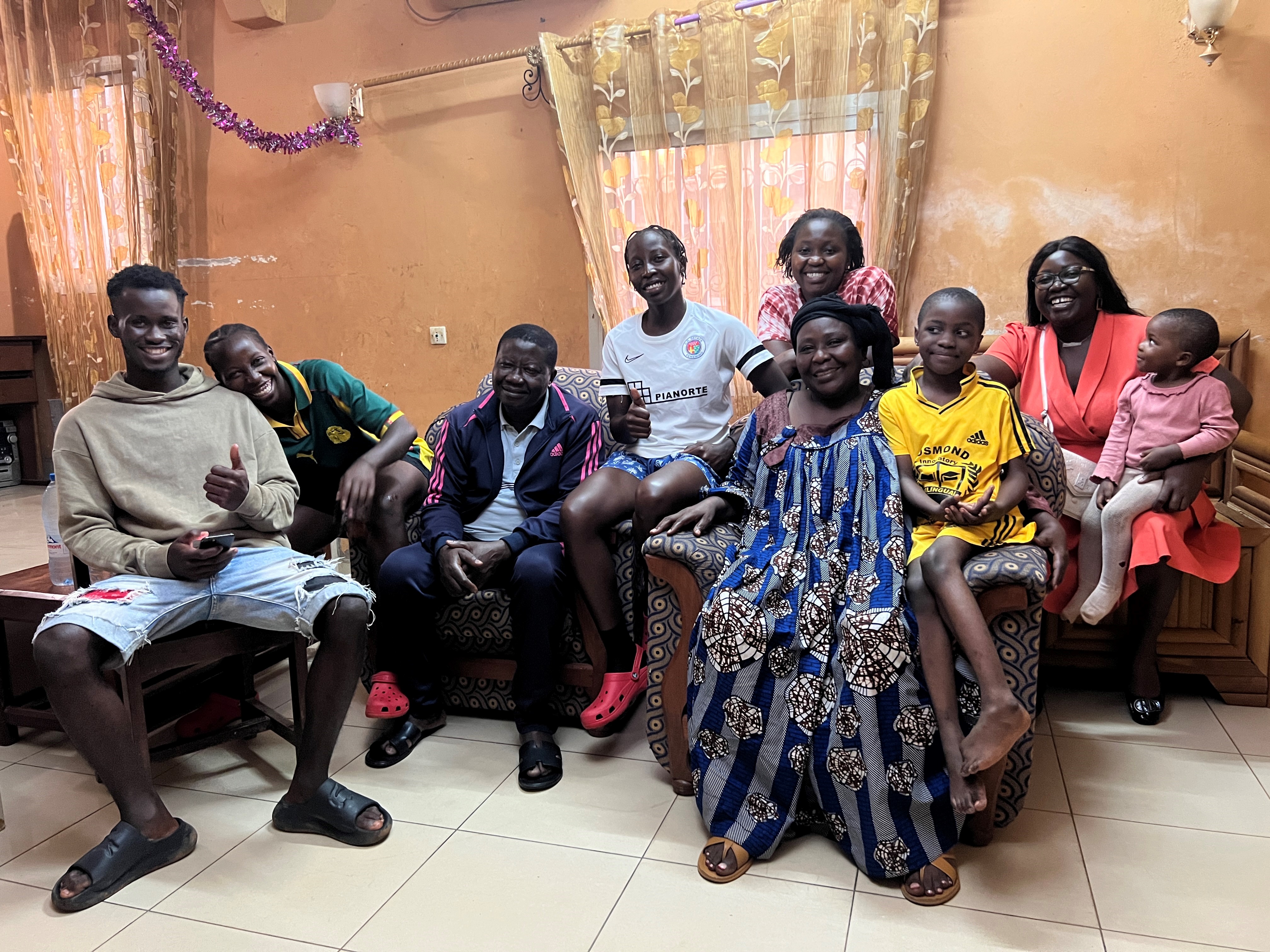 The Priso family in their home. The twins Pauline Marcelle and Rose Michelle are 2nd and 4th from the left. The parents on the armchairs in the centre.