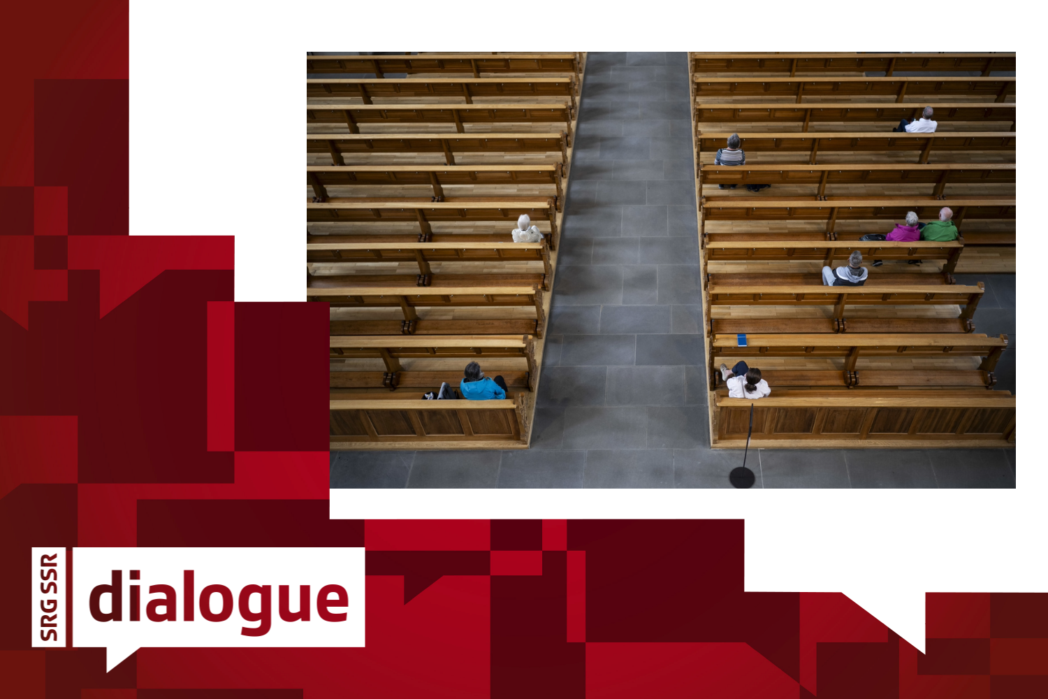 Few people are sitting on the benches in a catholic church.