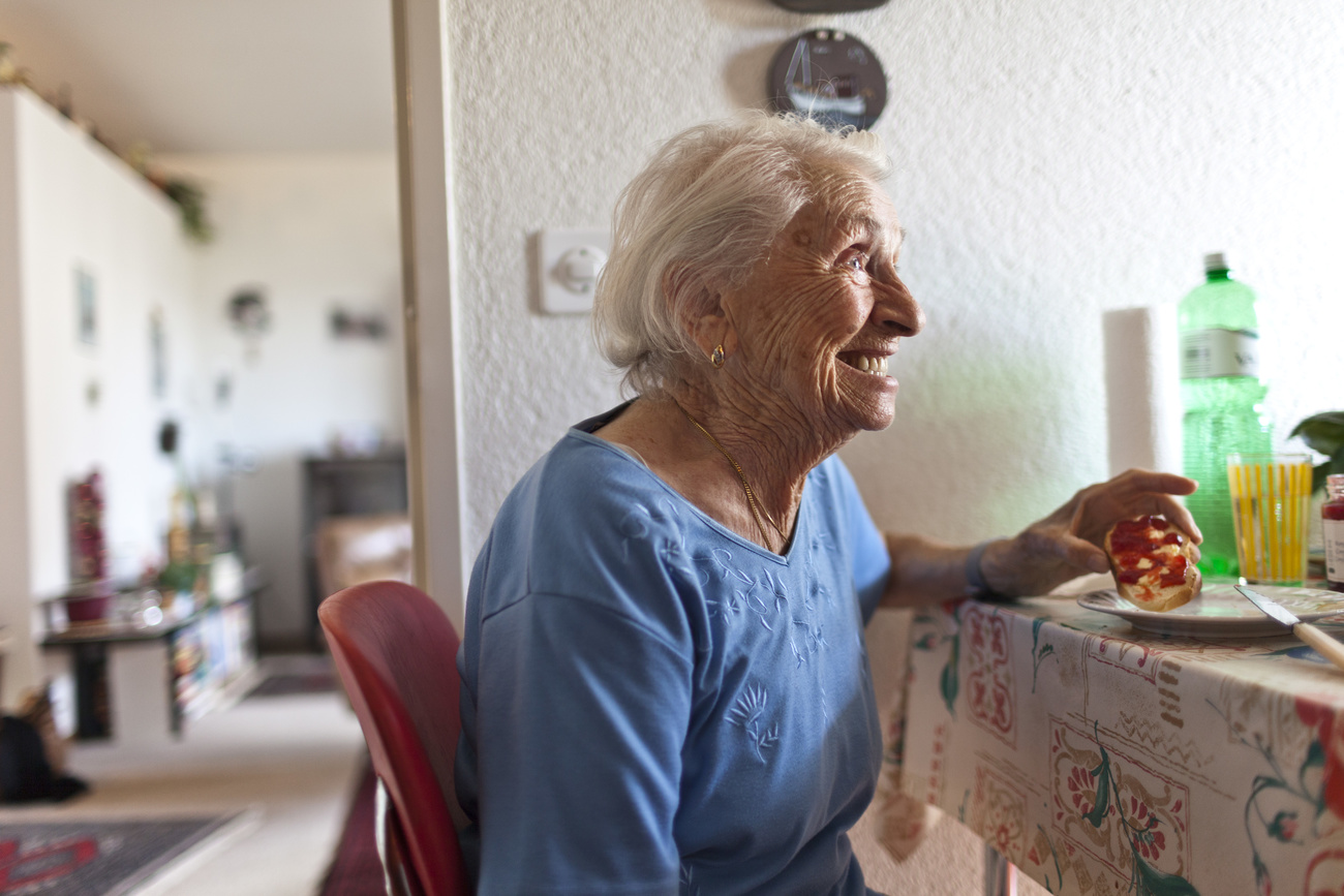 receives a visit of R. W., an employee of Spitex Biel, the municipal home care service, at her home in Biel, Switzerland, pictured on July 10, 2012