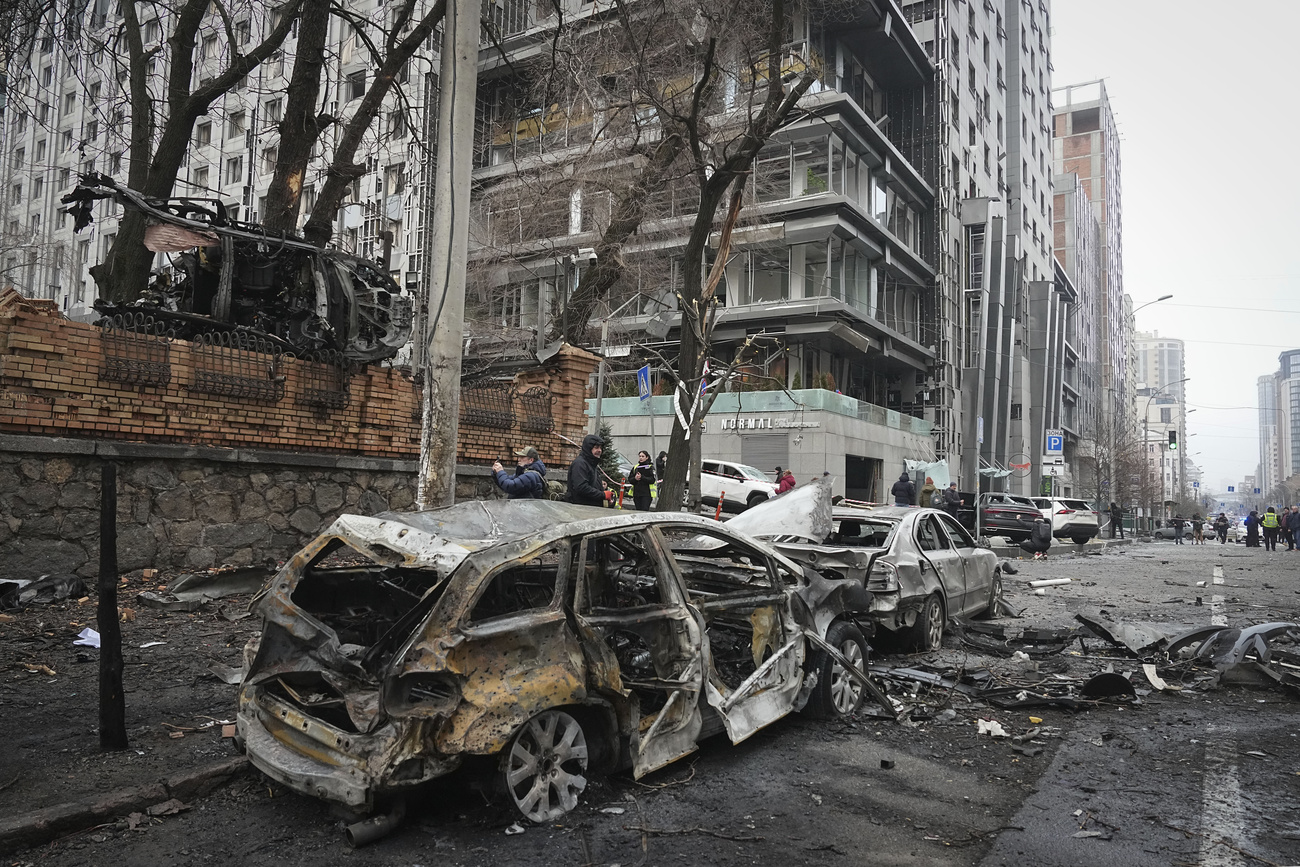 Bombed out car on street of Kyiv, Ukraine, Friday, Dec. 20
