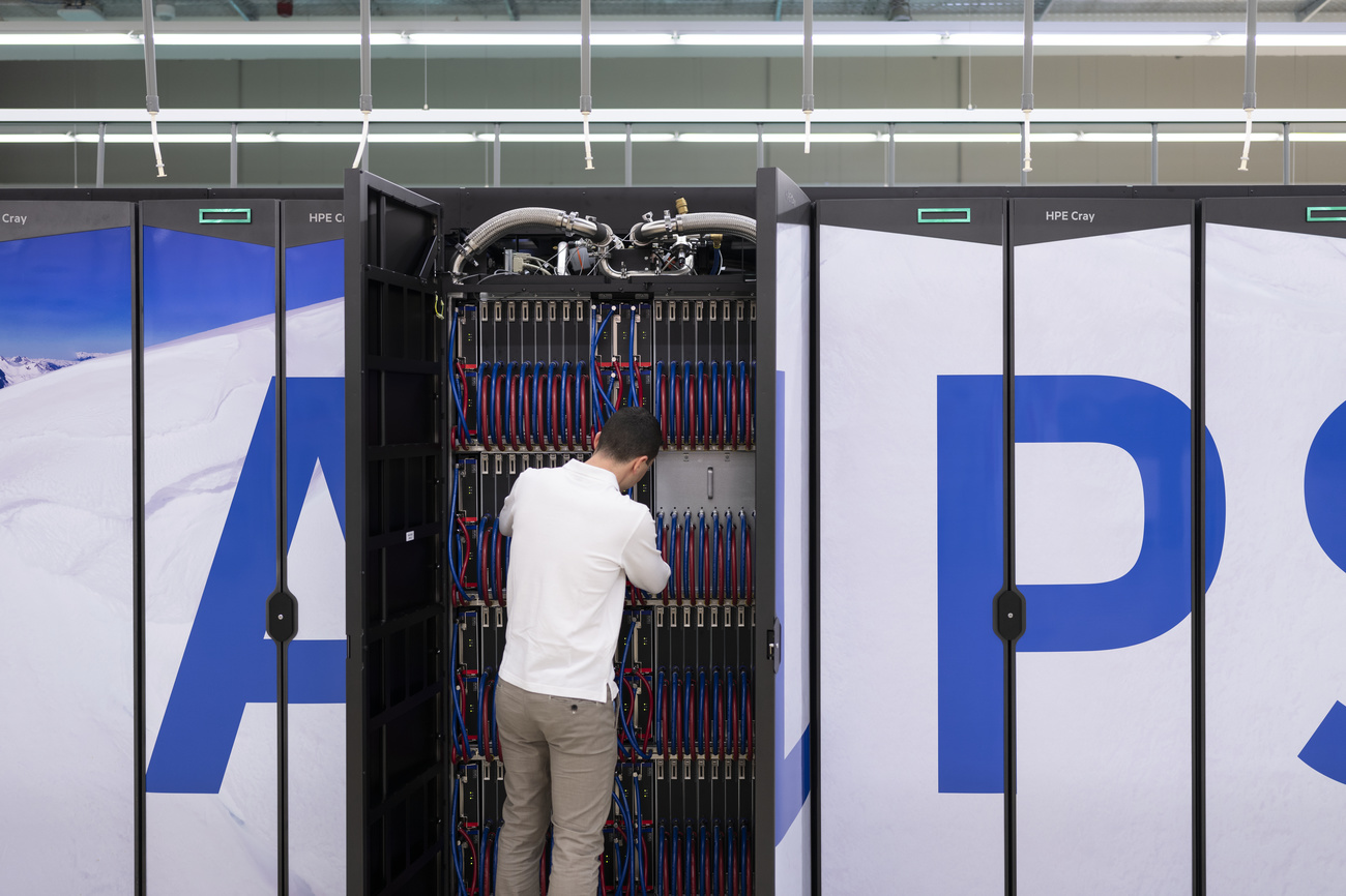 man looking at a supercomputer server
