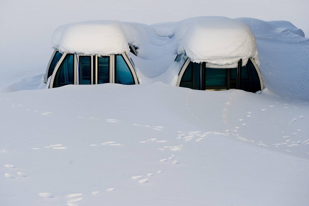 Ski cabins in the snow