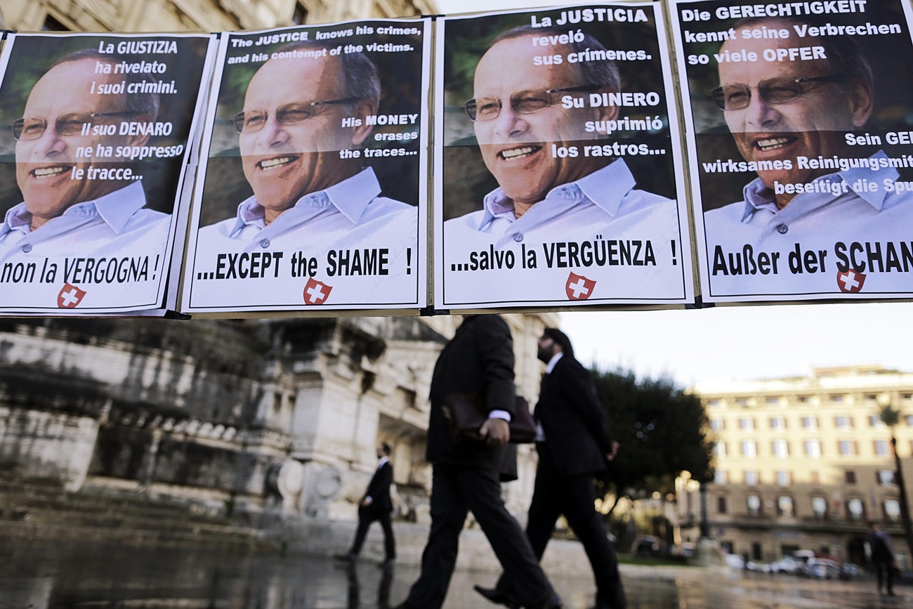 Posters condemning Stephan Schmidheiny's role in asbestos deaths in Italy.