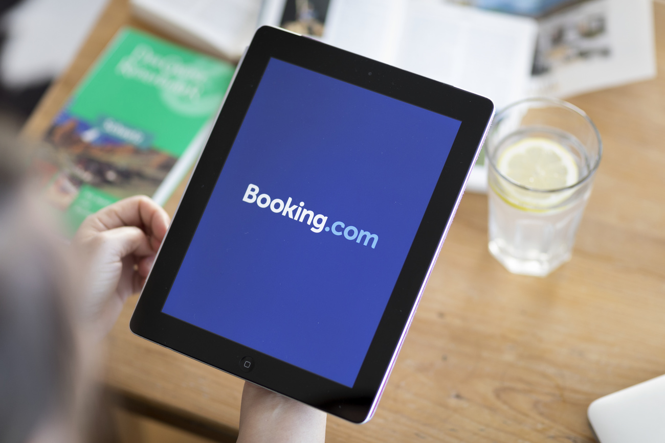 Photo of a person looking at Booking.com on a tablet