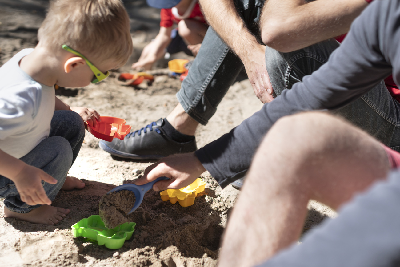 Child playing in sandbox