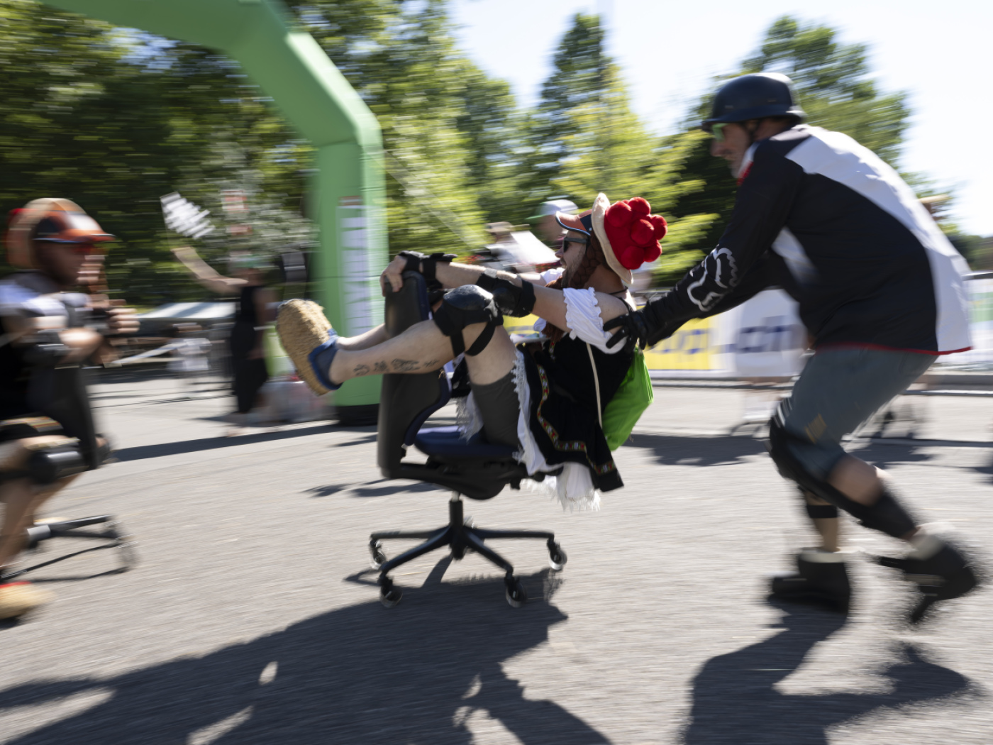 Daredevils race down a slope at the Office Chair World Championships in Olten