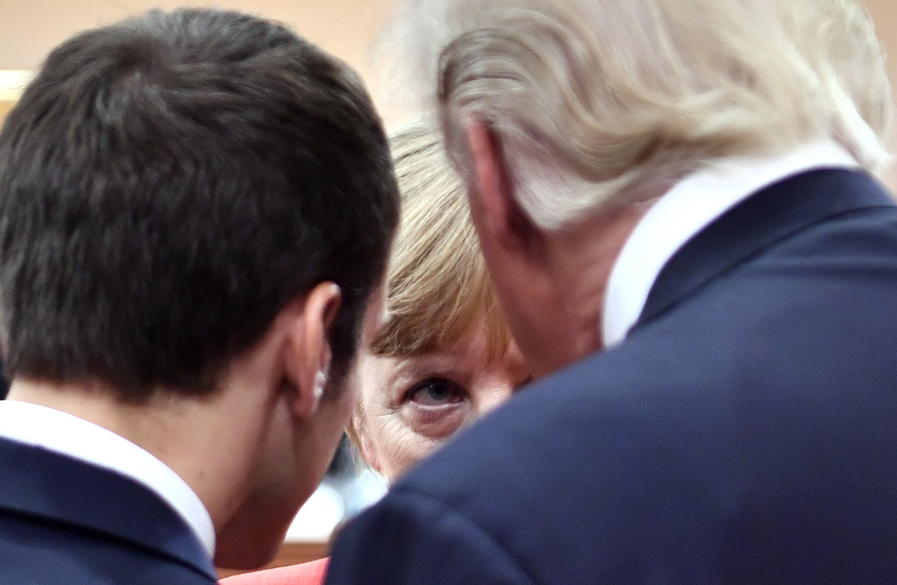 «Сложные личности»: Эммануэль Макрон, Ангела Меркель и Дональд Трамп на саммите G20 в Гамбурге 7 июля 2017 года. AFP / John MacDougall