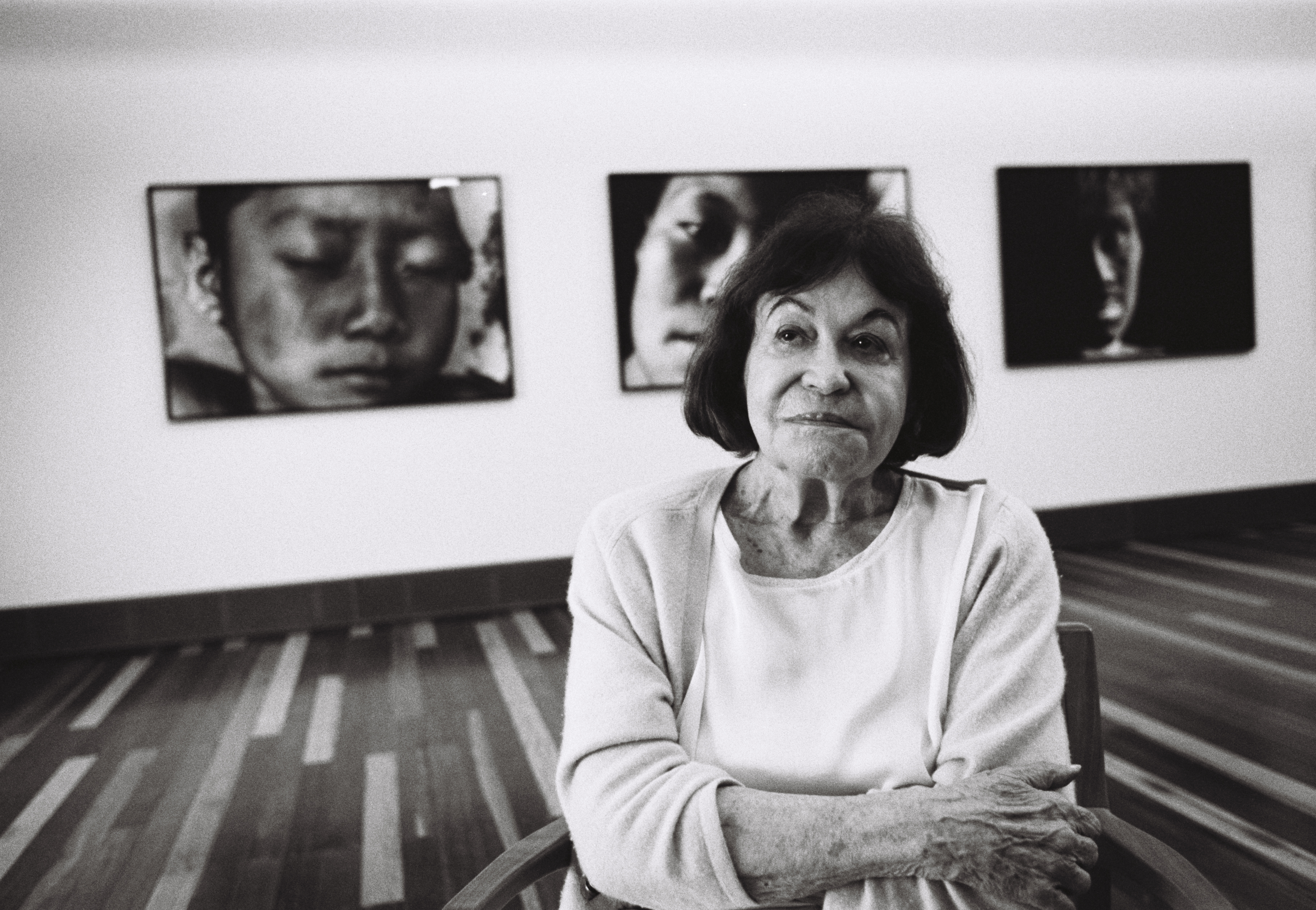 Andujar poses in front of some of her pictures, 2017.