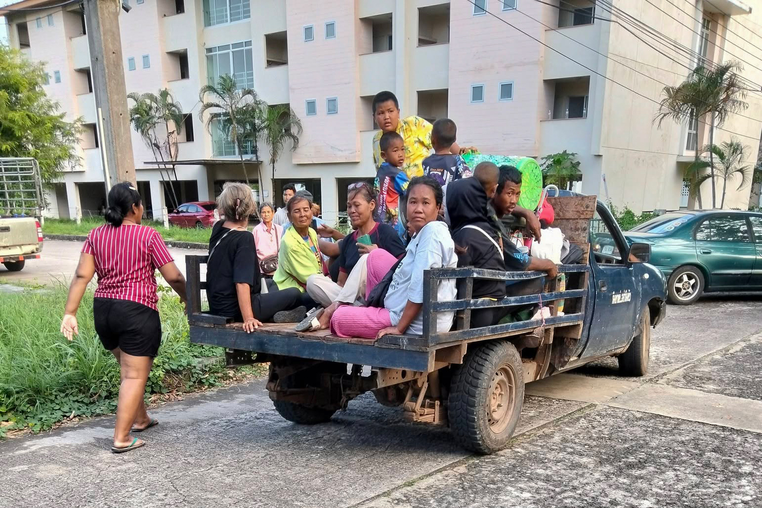 people on back of a pick-up truck