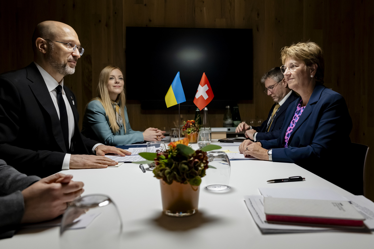 Viola Amherd, right, President of the Swiss Confederation, and Denys Shmyhal, left, Prime Minister of Ukraines, talk together during a bilateral meeting at the Ukraine Mine Action Conference, in Lausanne, Switzerland, Thursday, October 17, 2024.