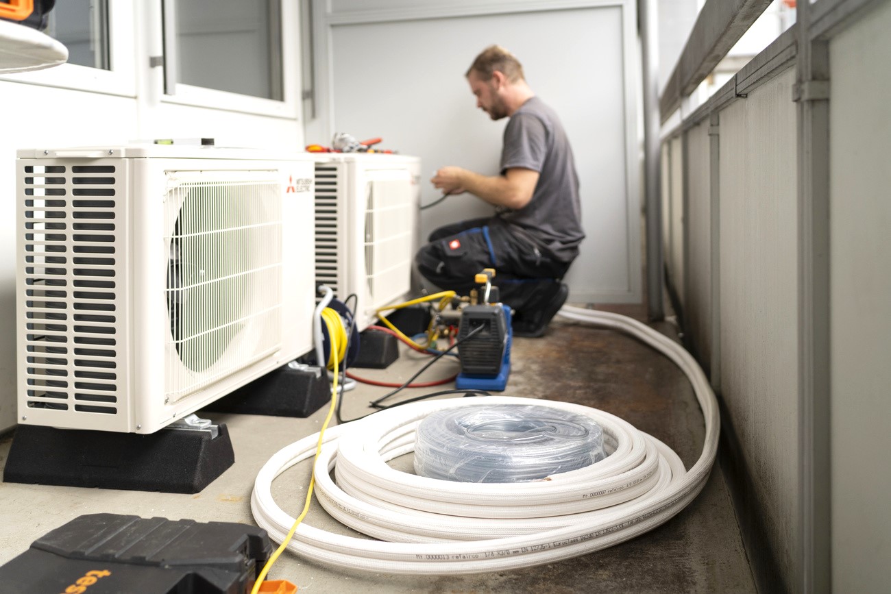 man installing air conditioner