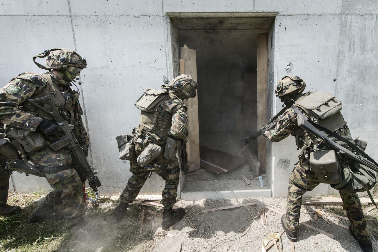 Swiss grenadier recruits take part in an urban warfare exercise in Isone, canton Ticino, in 2013.
