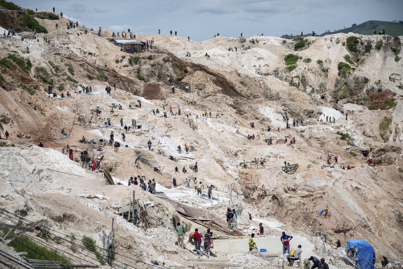 Motorcyclists ride through thick mud on their way to the mining town of Rubaya, Democratic Republic of Congo. The country supplies much of the world’s coltan.