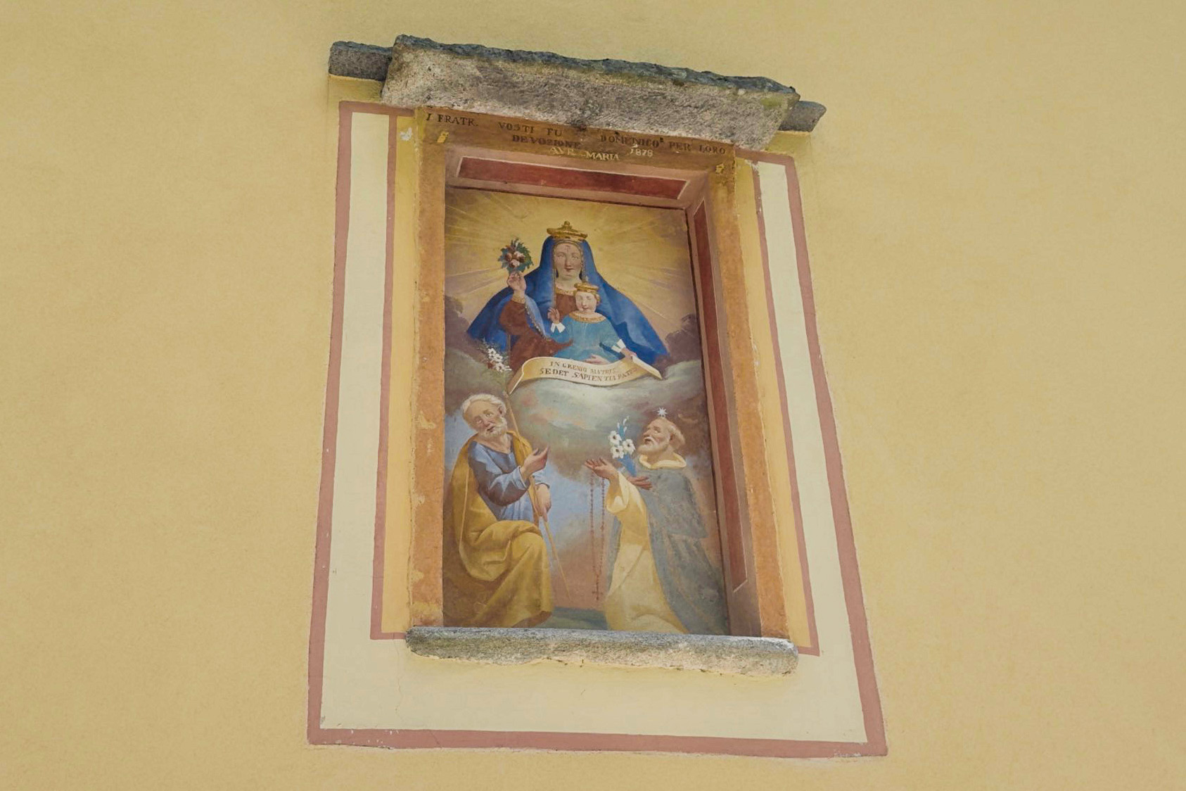 Religious painting on a house's outside wall