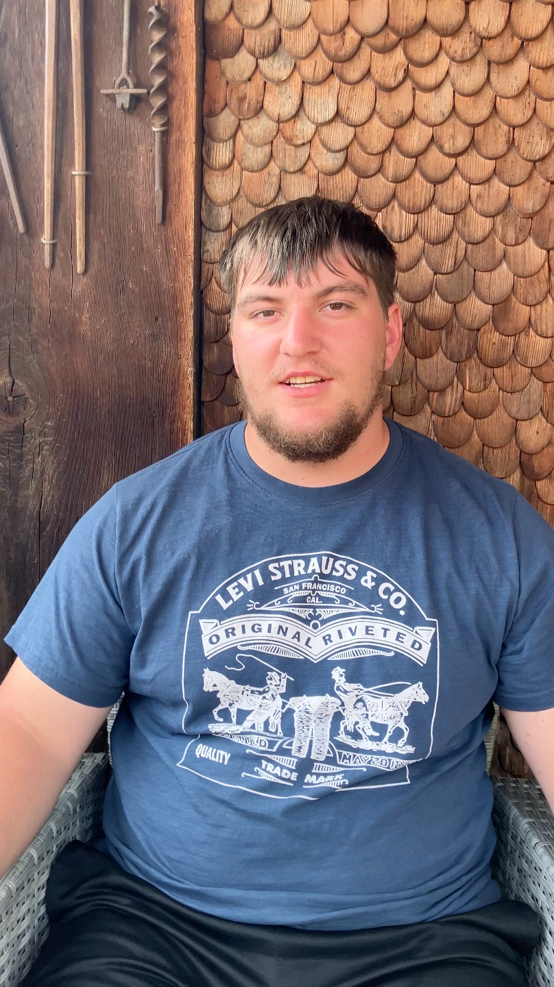 Photo of a man with blue t-shirt