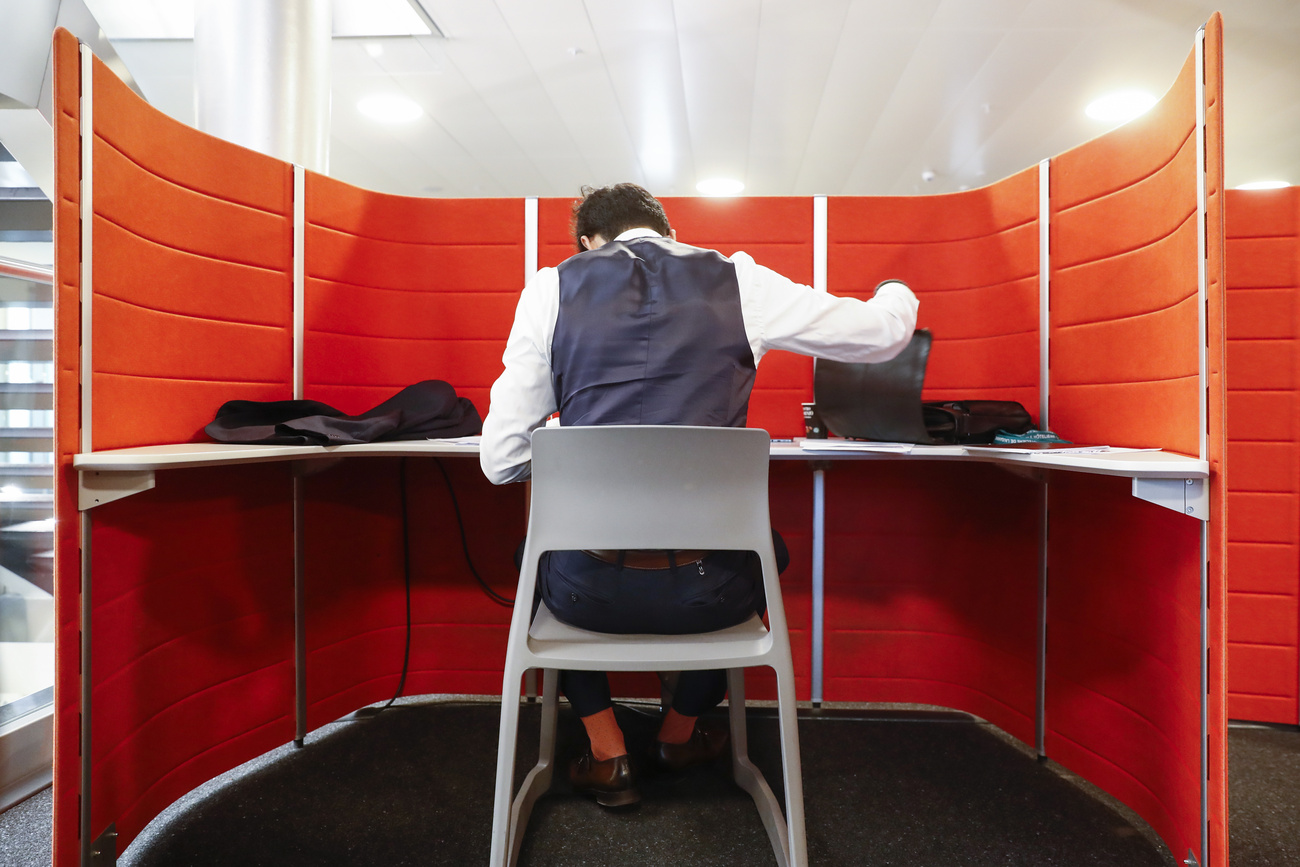 Swiss employee working at his desk