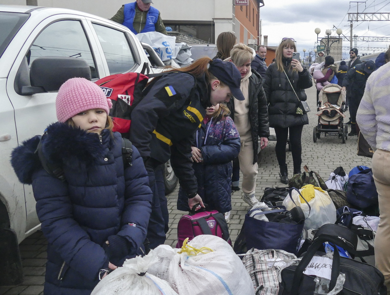 People evacuated from close to the frontline in the Donetsk and Dnipropetrovsk areas gather on a platform at a railway station in Mukachevo, western Ukraine, 17 March 2025, amid the Russian invasion. Fifty people were evacuated from regions affected by the conflict, including 30 adults and 20 children. According to the Representation of the Ukrainian Parliament Commissioner for Human Rights in the Transcarpathian region, these evacuees will be relocated to safer areas within Ukraine. In 2024, more than 30,000 people were evacuated from war zones, as reported by the Ukrzaliznytsia press service.