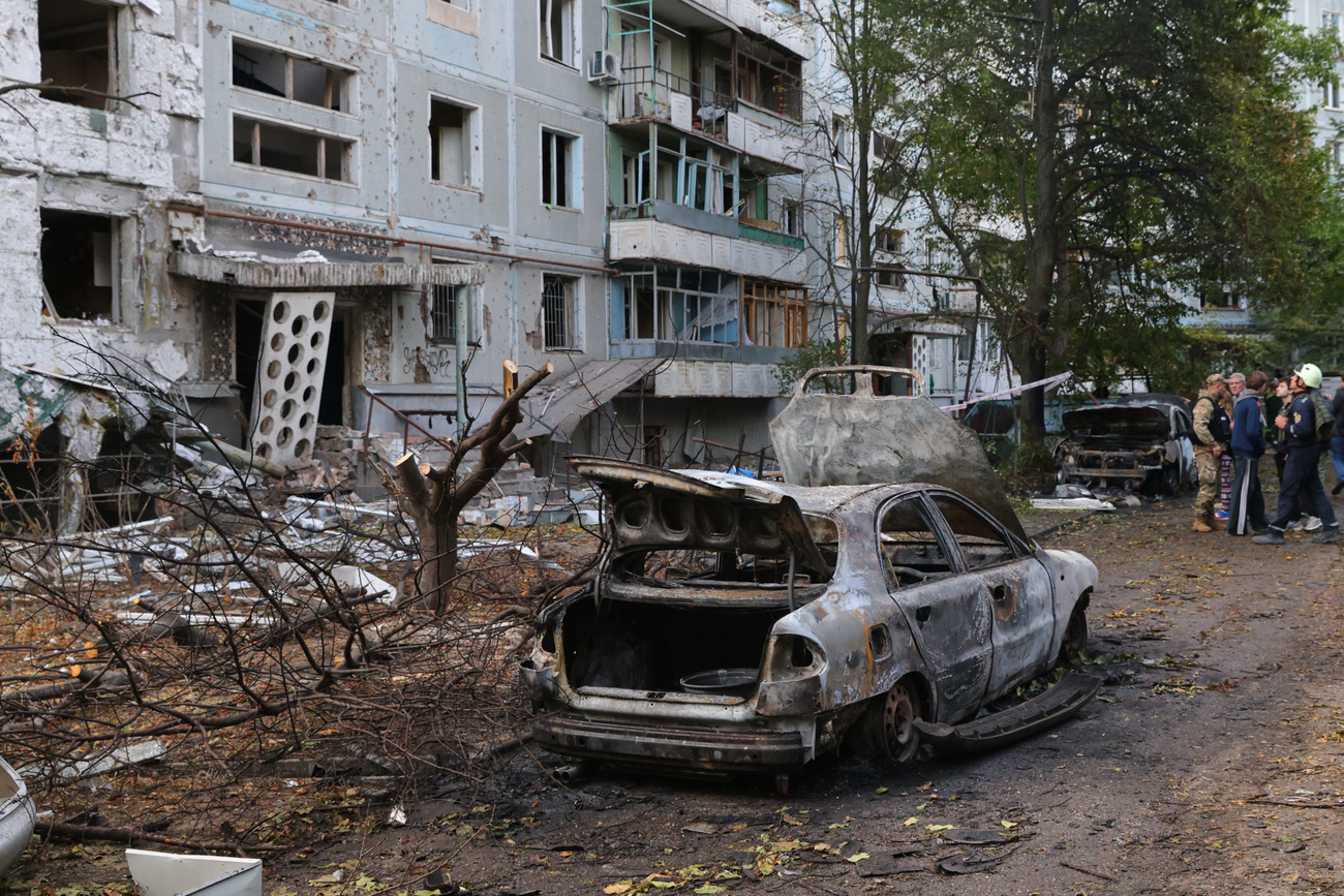 Burned out car and building in eastern Ukraine, October 5, 2025