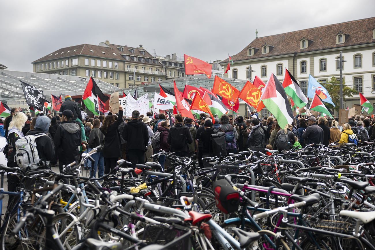 Photo of protesters with Palestinian flags in Bern.