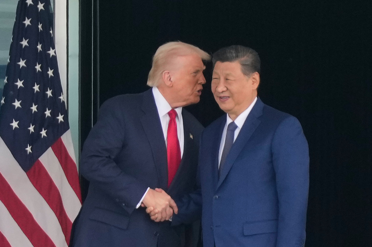 trump e xi jinpinmg si stringono la mano