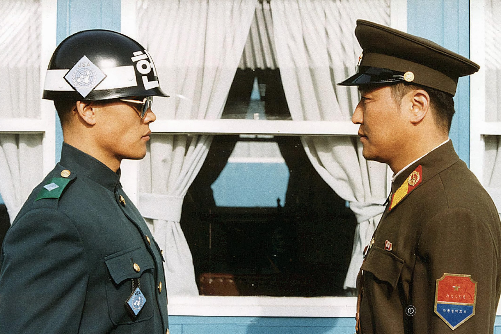 Formally, the two Koreas are still at war until today: a South Korean officer facing his North Korean counterpart in the demilitarized zone (DMZ) between the two countries in a scene of "Joint Security Area".