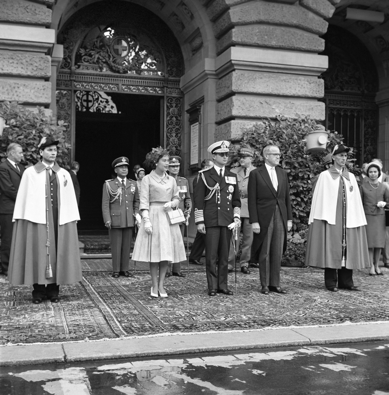 Swiss President Max Petitpierre, right, with the Thai royal couple Bhumibol Adulyadej, centre right, and Sirikit Kitigakara, left, in front of the Federal Parliament building in Bern, Switzerland.
