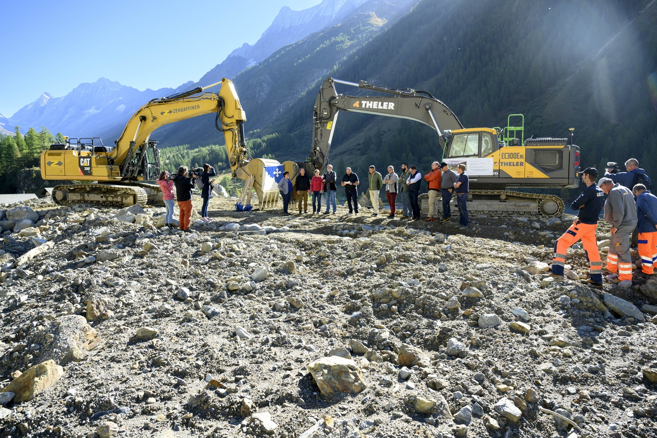 Representatives from the village of Blatten, the Lötschental valley, and the Blatten 2030 reconstruction project during the groundbreaking ceremony of reconstruction the village, project "Blatten 2030", 3,5 months after a landslide destroyed the village, in Blatten, Switzerland.