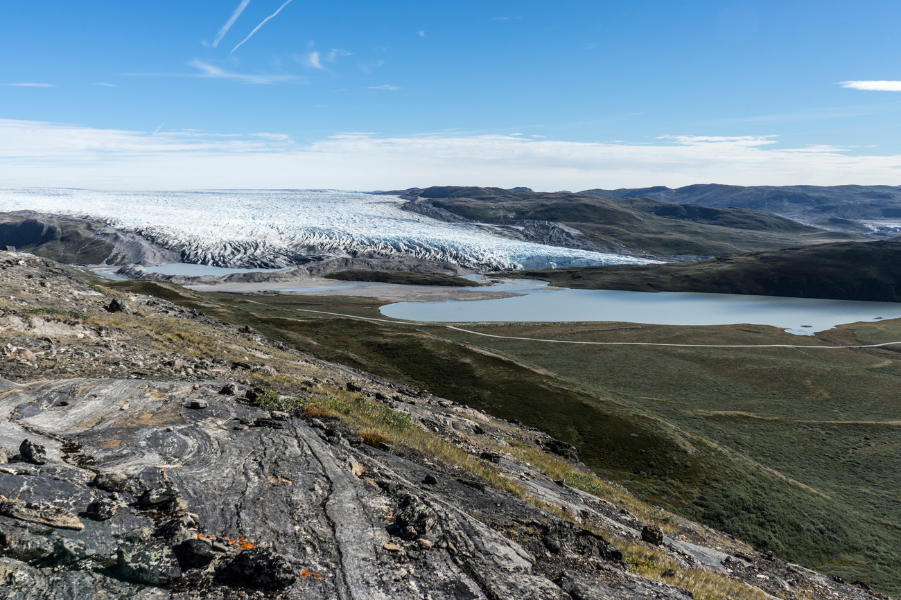 A panoramic view of a glacier stretching across a remote landscape