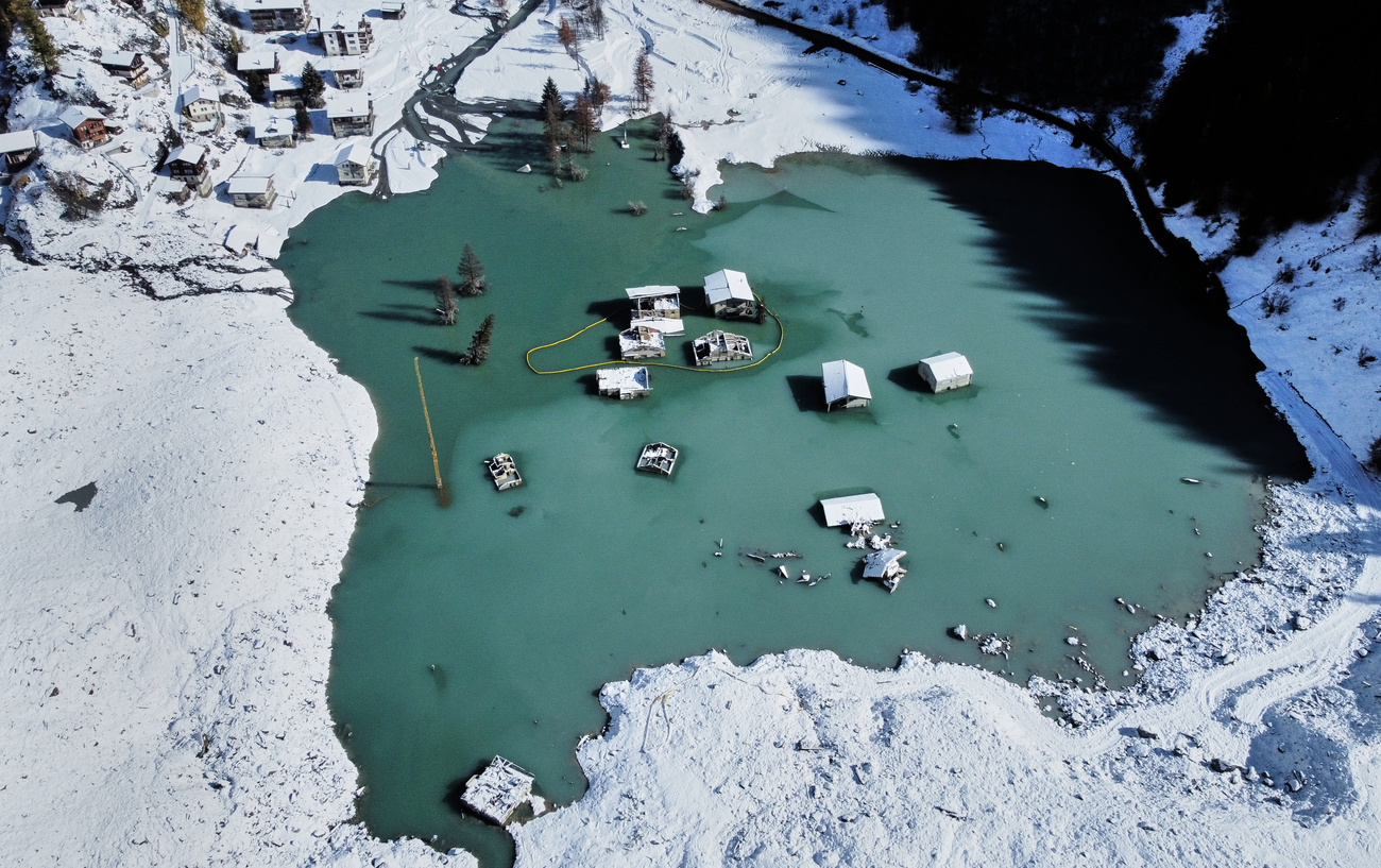 An aerial view shows the partly flooded village of Blatten after recent snowfalls, five months after a landslide destroyed the village, October 28, 2025.