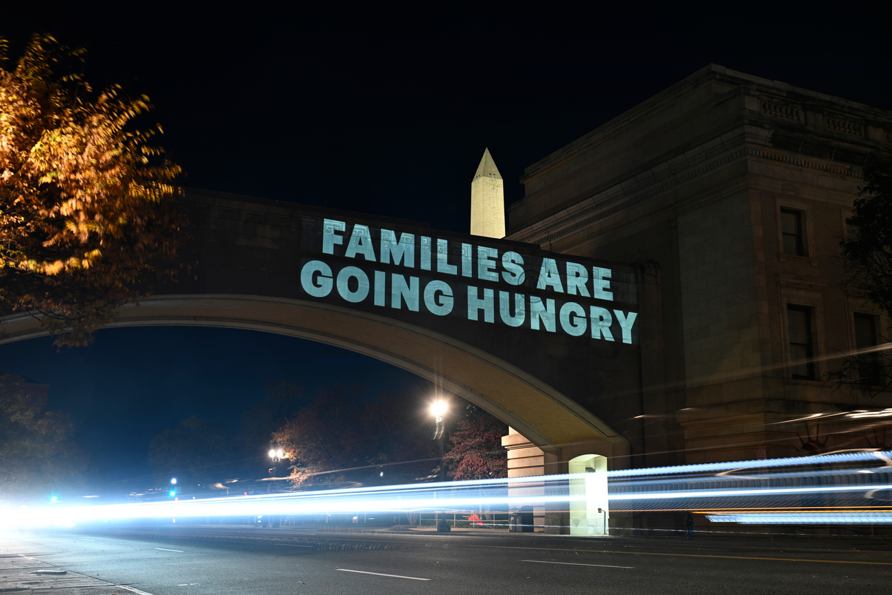 A message from the National Women’s Law Center is projected on the US Department of Agriculture building in Washington, DC, on Monday