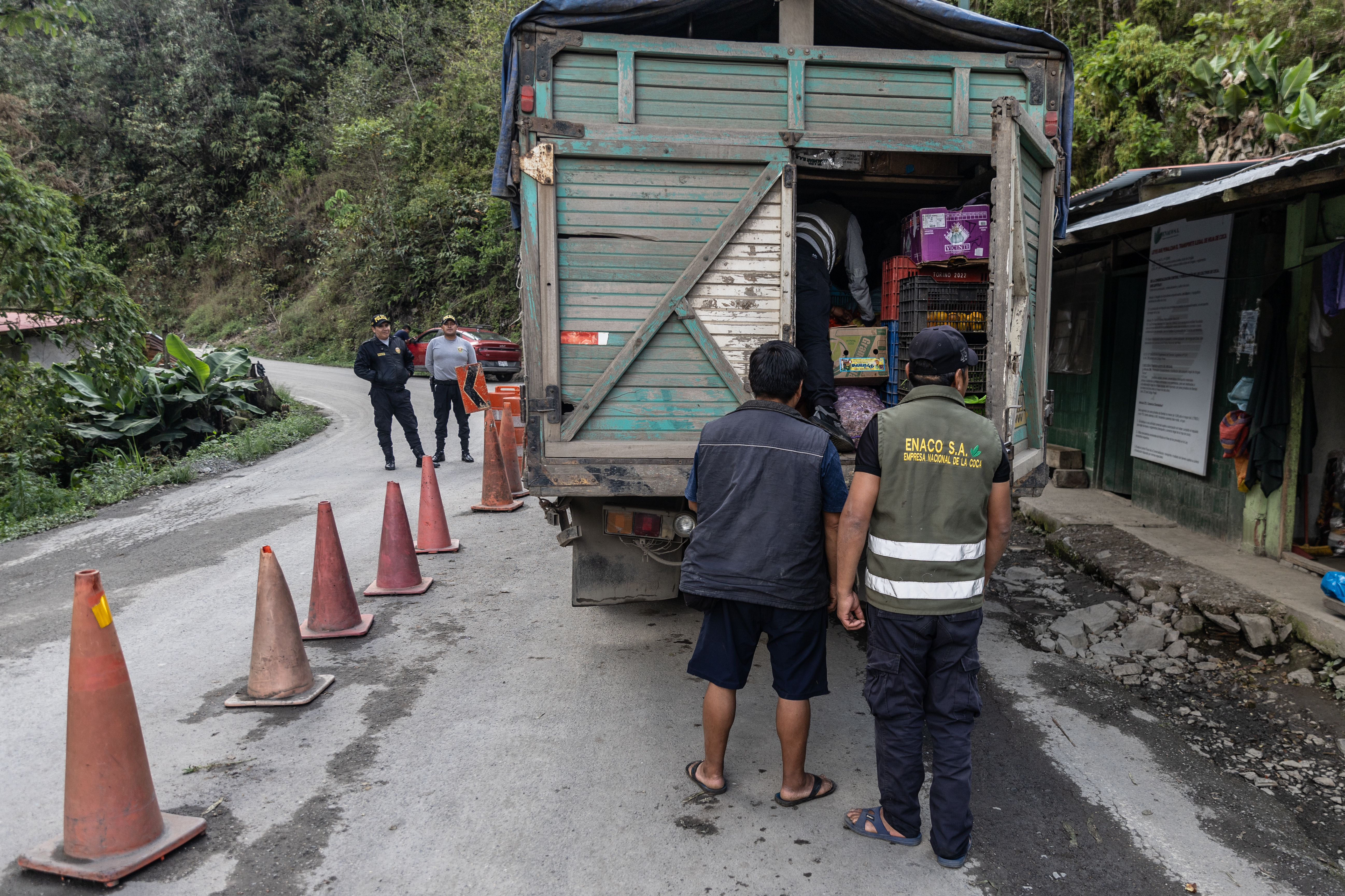 The back of a truck stopped at a checkpoint