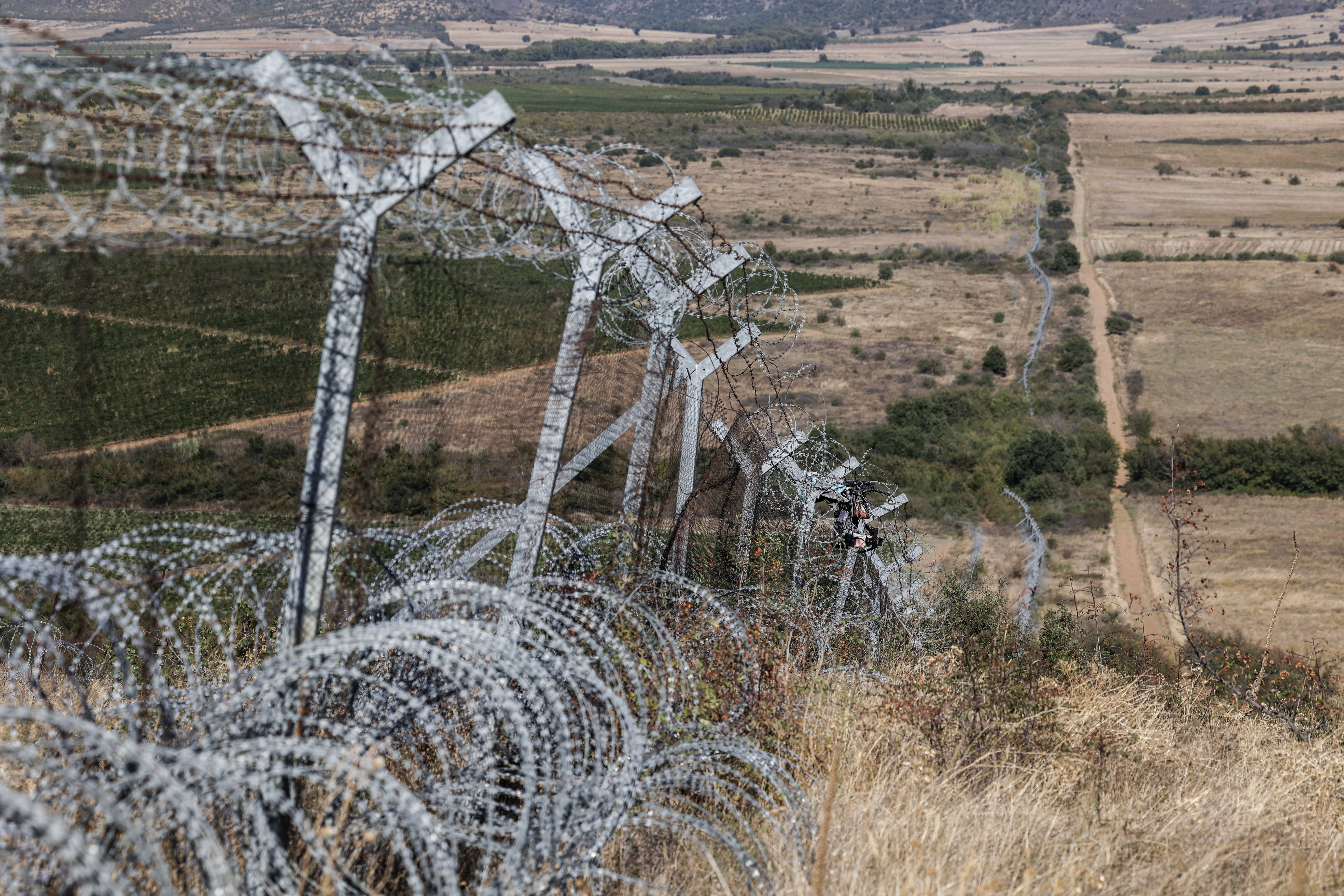 A fence with barbed wire