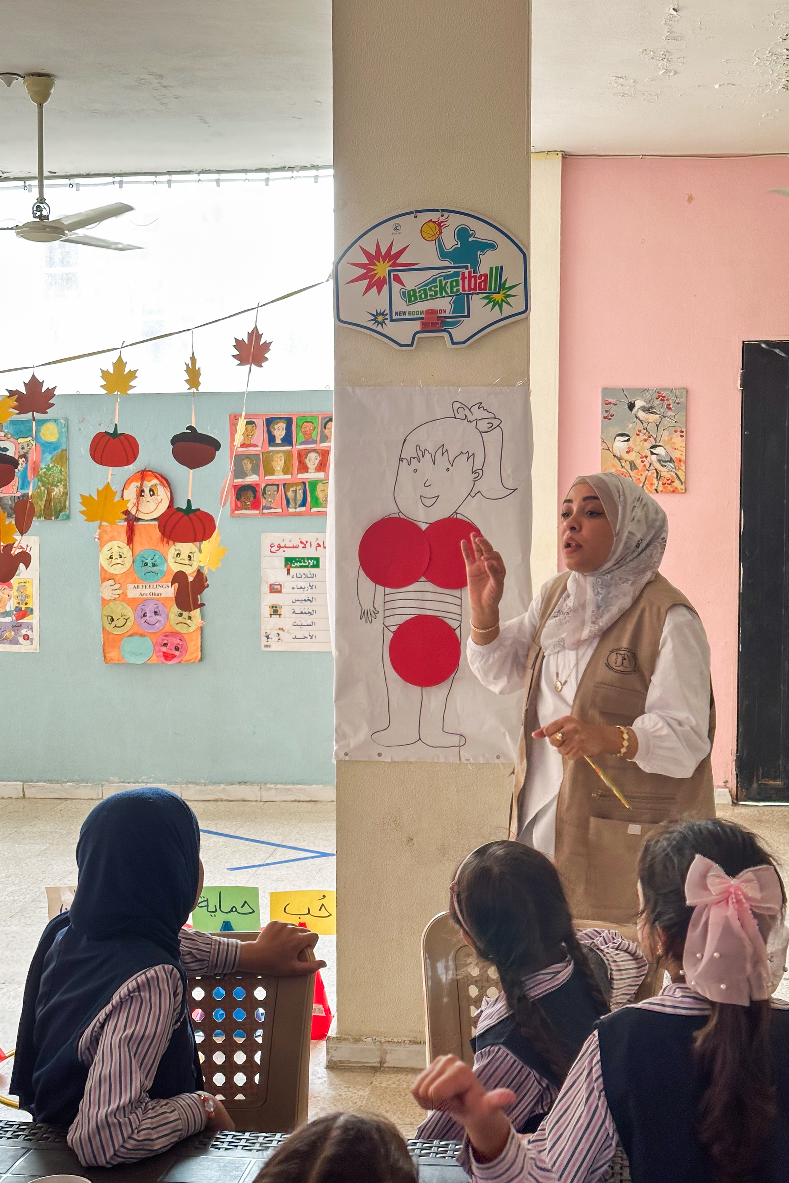 A teacher and several schoolgirls