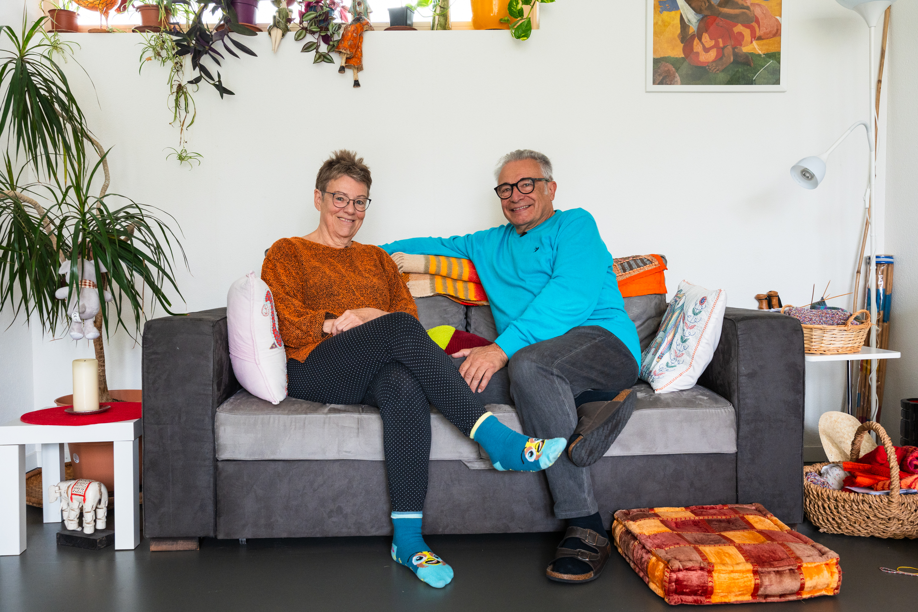 Two people sitting on a couch