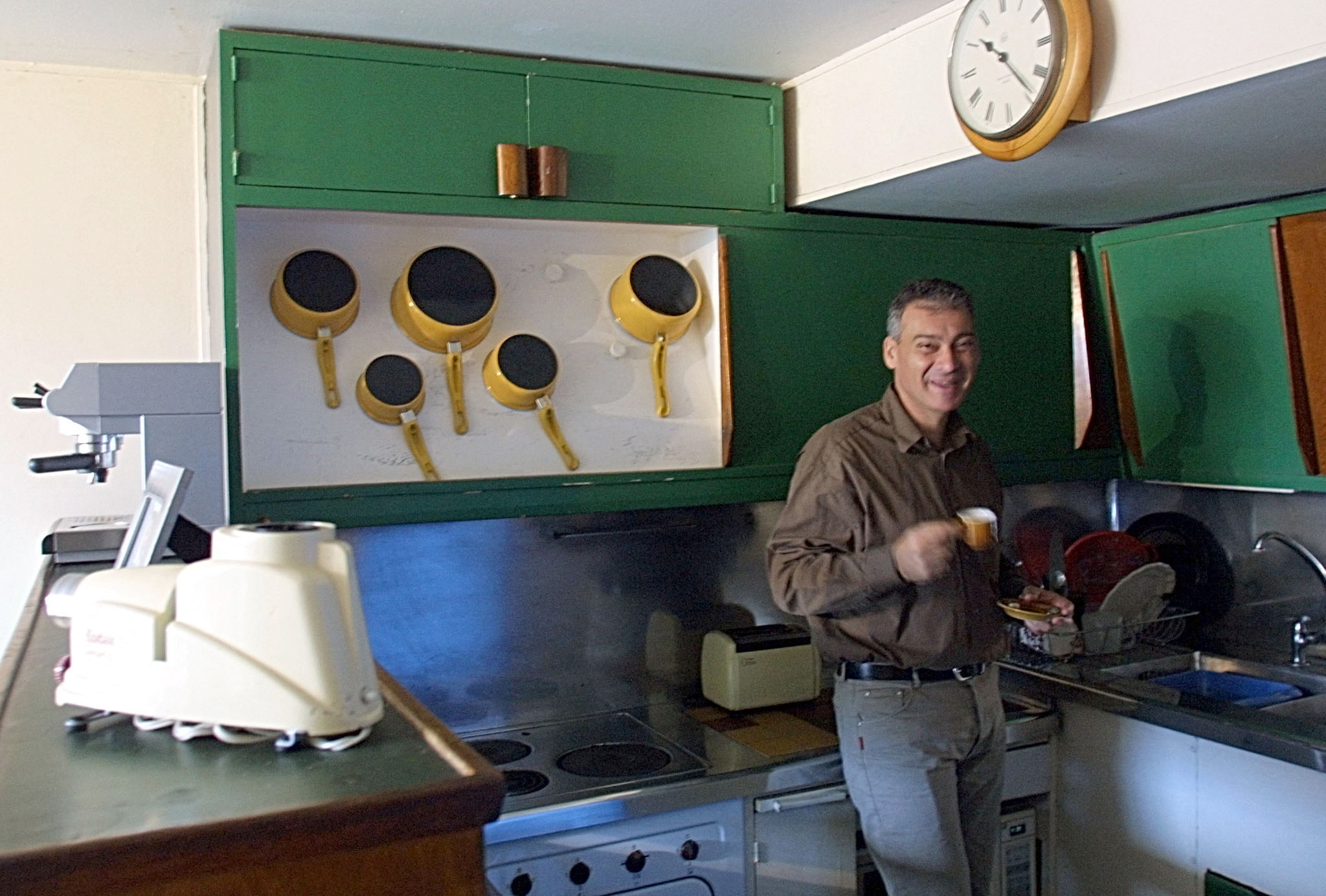 Patrick de Rosario, director of La Cité Radieuse in Marseille, eats breakfast in his kitchen, where even the cupboards are classified as historical monuments.