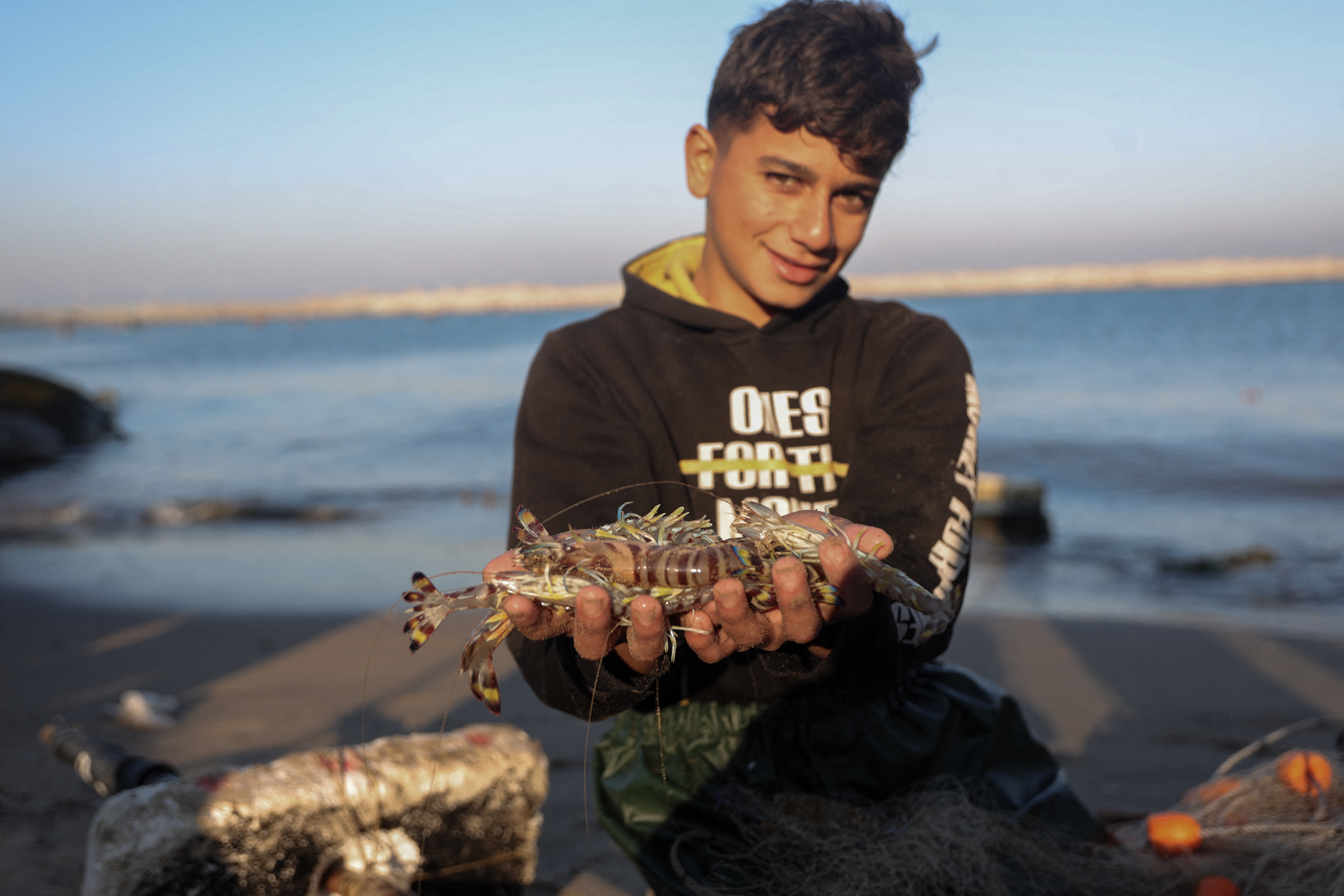 DECEMBER 18: Palestinian fishermen continue to work along the coastline of the besieged city of Gaza, under extremely difficult conditions, striving to earn a living and combat hunger despite limited resources and equipment damaged by Israeli attacks on December 18, 2025.