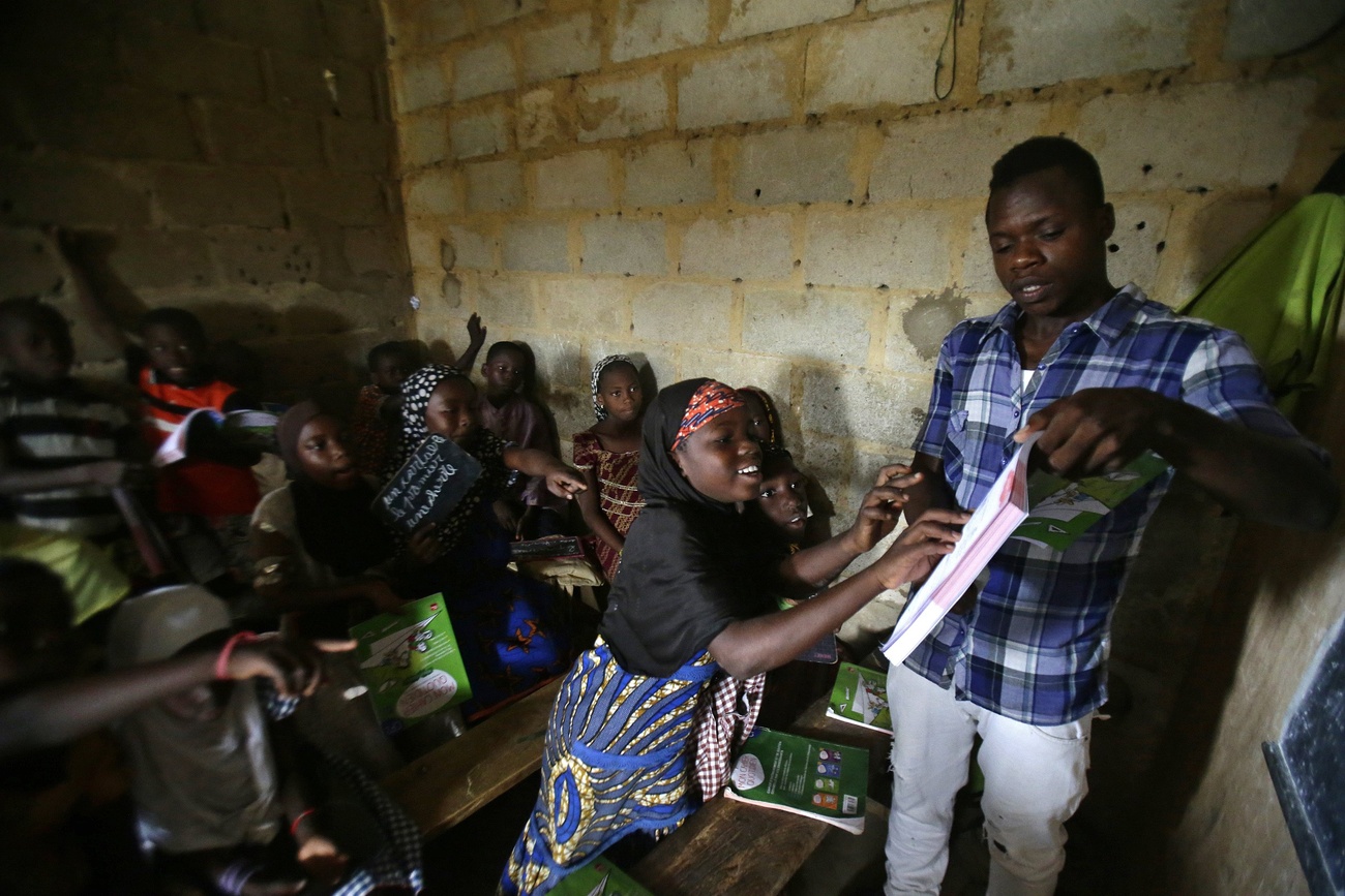 Schoolchildren with their teacher in Abidjan, Ivory Coast