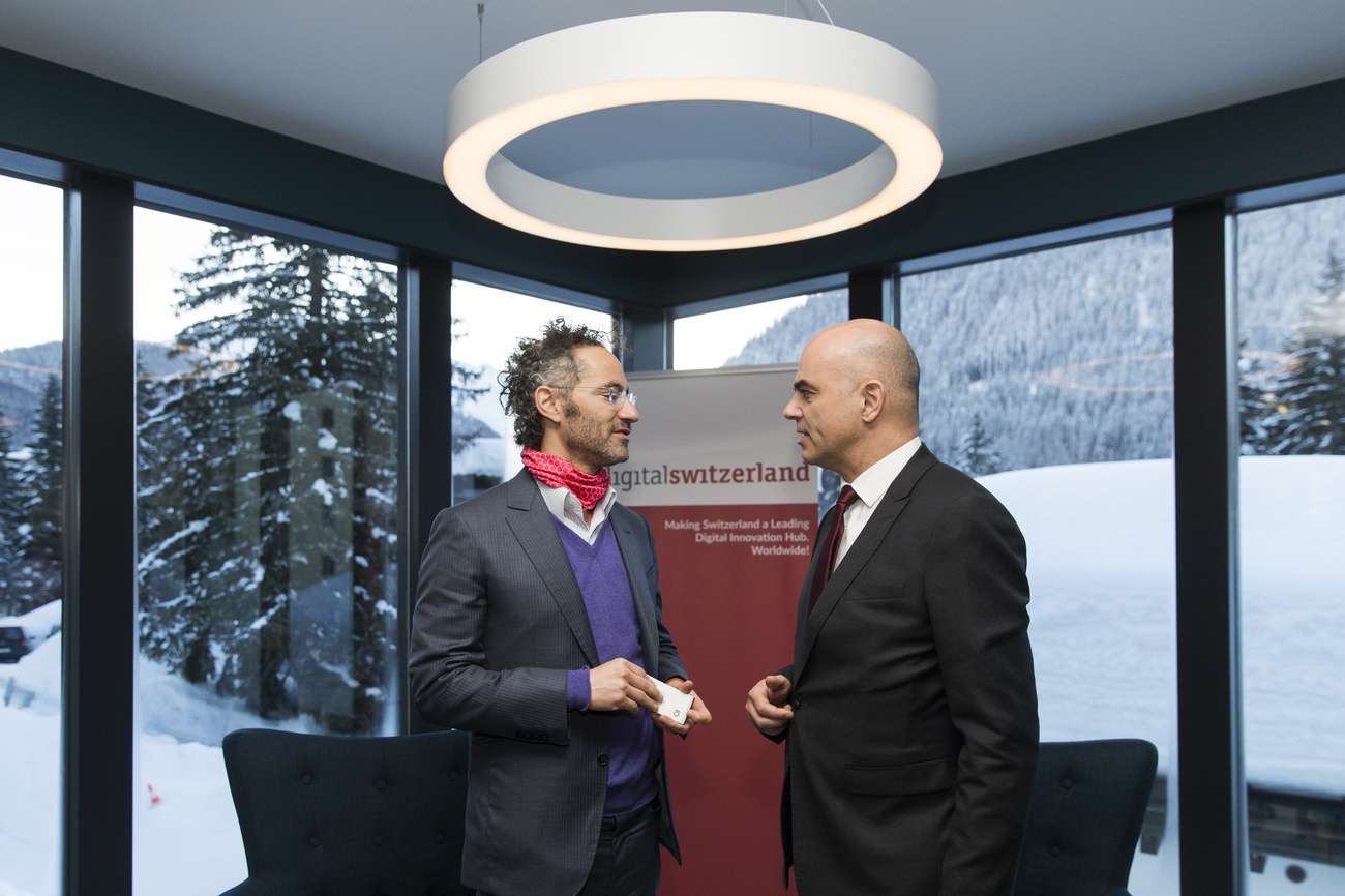 January 2018: Swiss Federal President at the time Alain Berset, right, speaks to Alex Karp, CEO Palantir, after a panel session about "Digital Switzerland", at the Annual Meeting of the World Economic Forum in Davos, Switzerland.