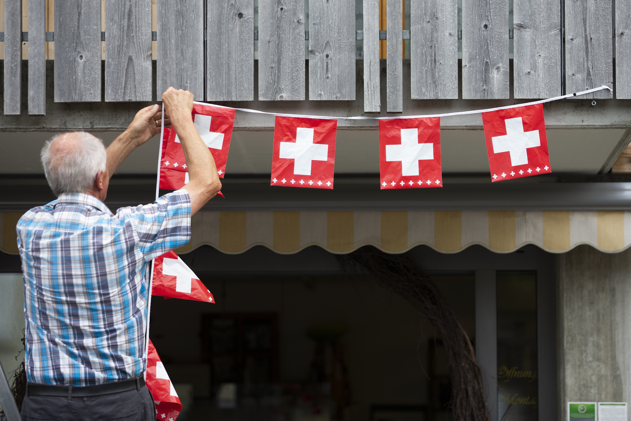 Man putting up flags